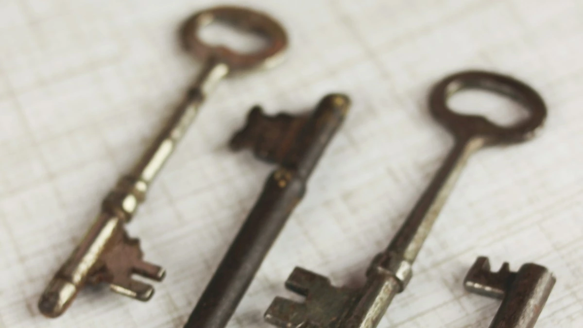 Four antique skeleton keys laid out on whitewashed wooden boards. — a The Obsidian Key guide to Access Without Alignment Is a Curse Explained.