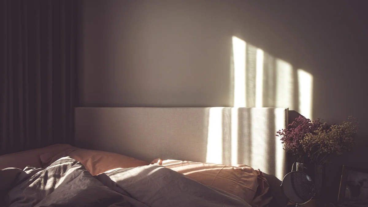 Morning light falls across an unmade bed beside a nightstand holding dried flowers. — a The Obsidian Key guide to Allocation Not Isolation: Family and Attention.