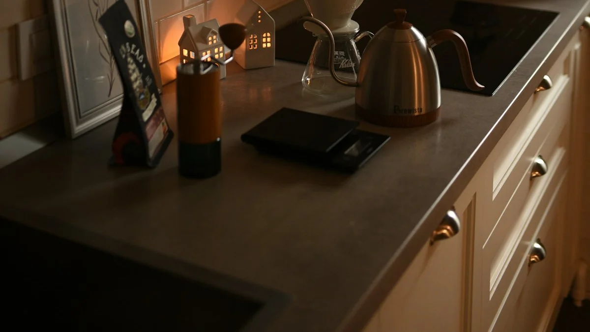 A small kitchen counter with a kettle and pour-over coffee gear in warm lamplight. — a The Obsidian Key guide to Apartments Warehouses and Checkout Lines.