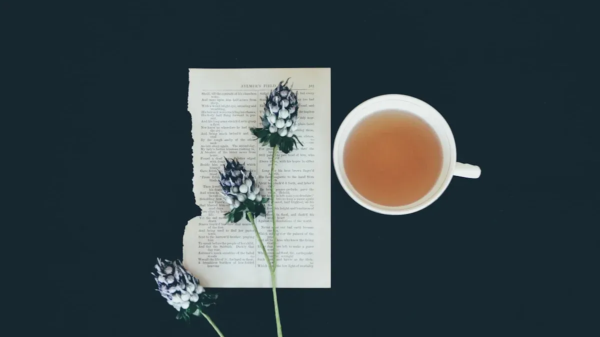 A cup of amber tea beside a torn book page and dried flowers on a dark table. — a The Obsidian Key guide to The Assumption Seat: Setting Identity Before Breakfast.