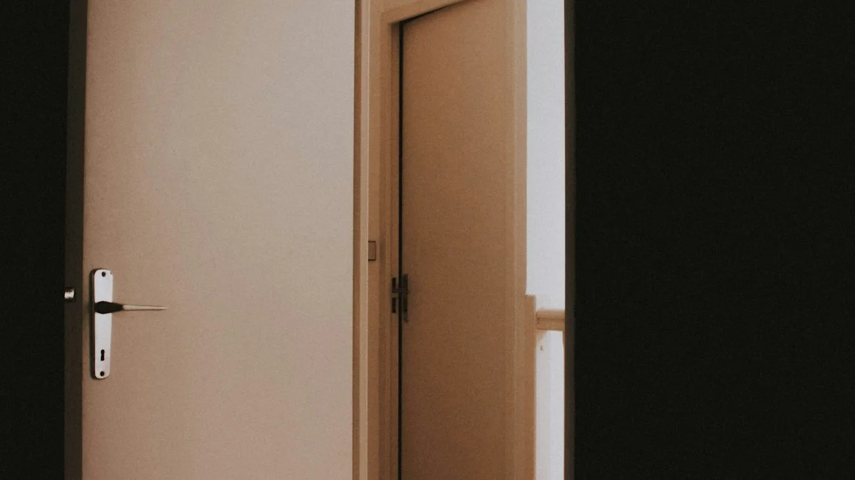 A pale door stands ajar, opening from a dark room into warm light. — a The Obsidian Key guide to Begin the Twenty-One Day Wealth Operation.