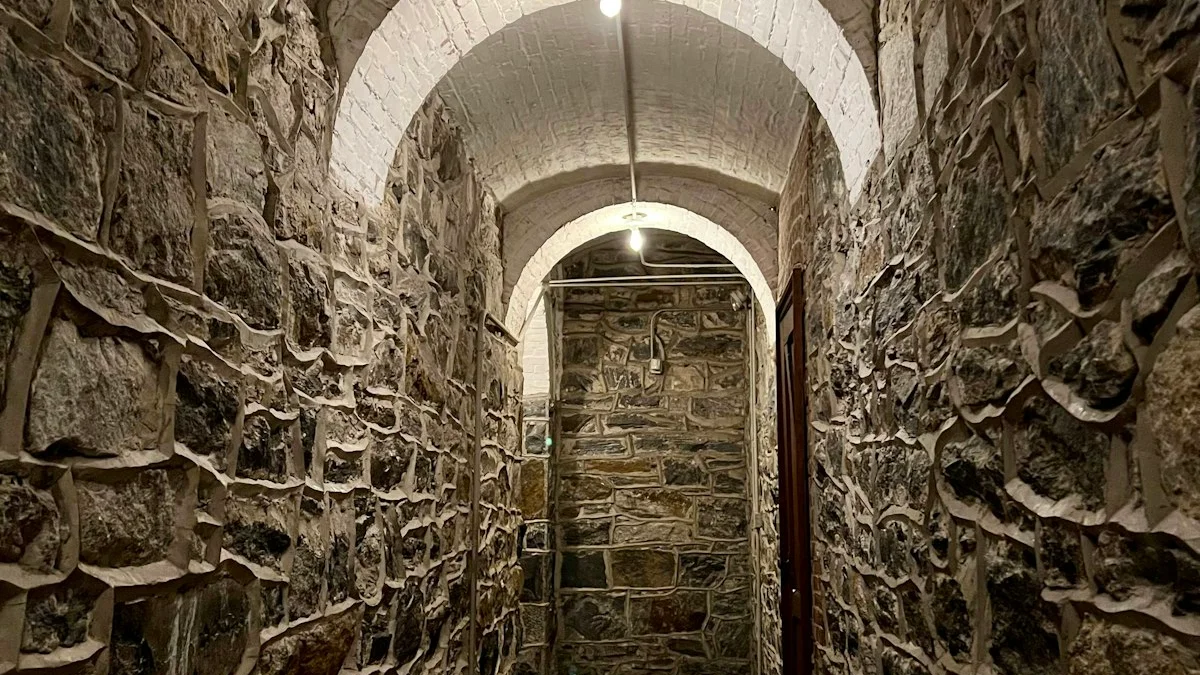 A lamp-lit stone corridor with vaulted arches and a wooden door at its end. — a The Obsidian Key guide to Beyond Part I: Where the Architecture Becomes Practice.