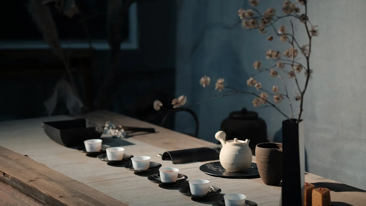 A quiet tea table with a clay teapot, small cups, and dried branches in soft light. — a The Obsidian Key guide to Warmth Food Sleep: The Body's Room.