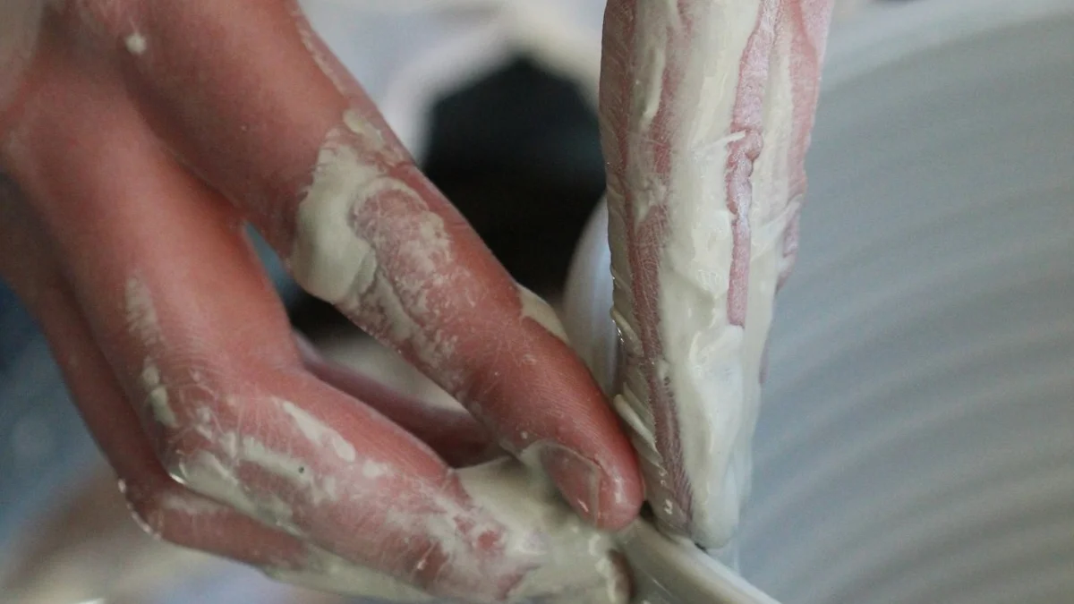 Clay-covered hands shape the rim of a wet bowl at a pottery wheel. — a The Obsidian Key guide to Ending the Sit: The Closing Breath and Daily Intention.