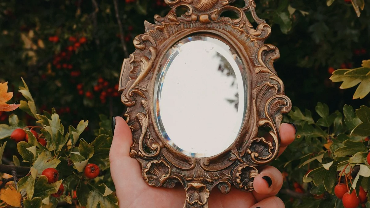 A hand holds an ornate antique brass hand mirror against a wall of autumn berries and leaves. — a The Obsidian Key guide to Day 21: Reading Your Own Handwriting as Evidence.