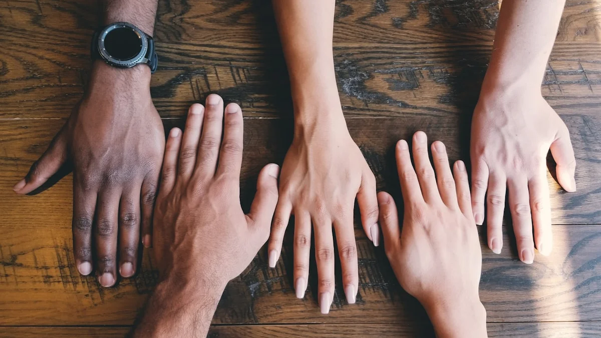 Five open hands resting on a warm wooden table in soft light. — a The Obsidian Key guide to Desire Announces Absence: The Broadcast of Want.