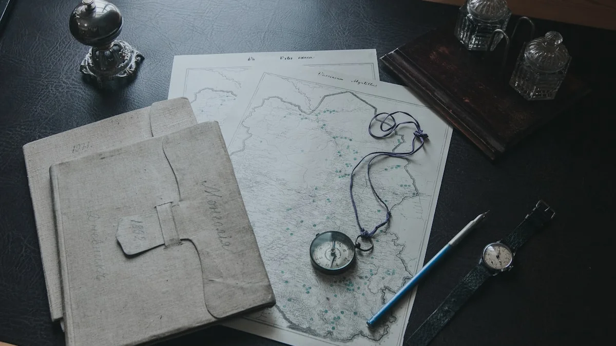 Antique linen folders, a map, a brass compass, and a fountain pen are laid out on a dark desk. — a The Obsidian Key guide to The Desk as an Address of Authorship.