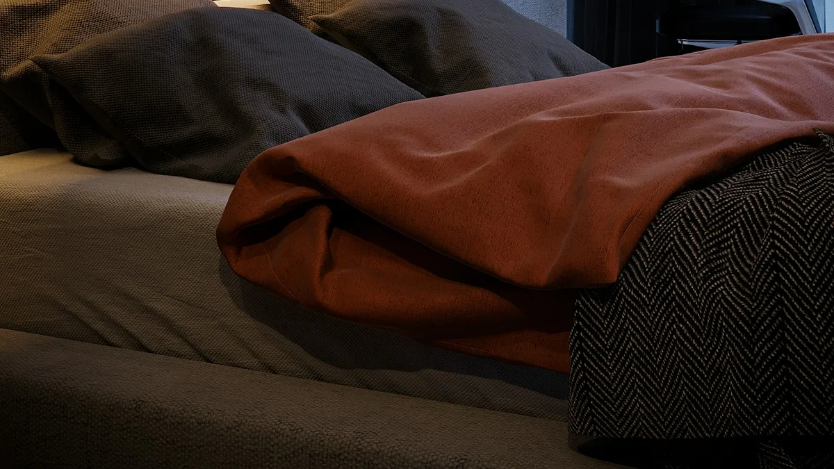 A rust wool blanket lies folded across a bed in low lamplight. — a The Obsidian Key guide to Falling Asleep in the Seat: What It Means and How to Fix It.