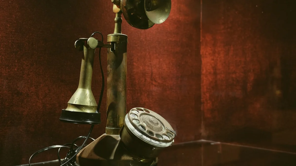 An antique brass candlestick telephone stands against a dark red wall. — a The Obsidian Key guide to Guilt and Urgency: The Two Instruments of the Lean.