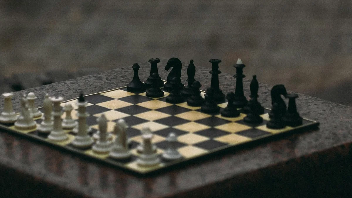 A chess game stands mid-play on a wet stone table under gray rain. — a The Obsidian Key guide to Law Violations: What Breaking Each One Broadcasts.
