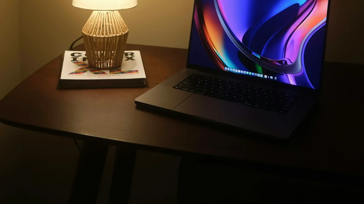 A warm table lamp glows over an open laptop on a dark wooden desk at night. — a The Obsidian Key guide to Does the Obsidian Key Work for Money Anxiety.