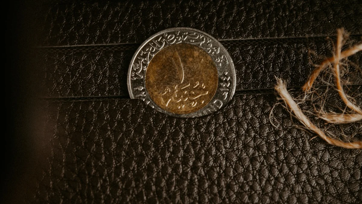 A single bimetal coin resting inside the pocket of an open black leather wallet. — a The Obsidian Key guide to Pay Yourself First as a Signal Not Arithmetic.