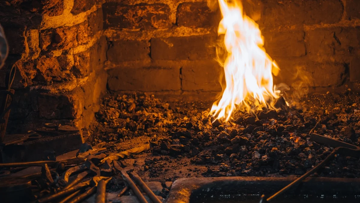 A small fire burns over dark coals inside a brick forge at night. — a The Obsidian Key guide to Protect Your Energy: Start the Daily Shield Practice.