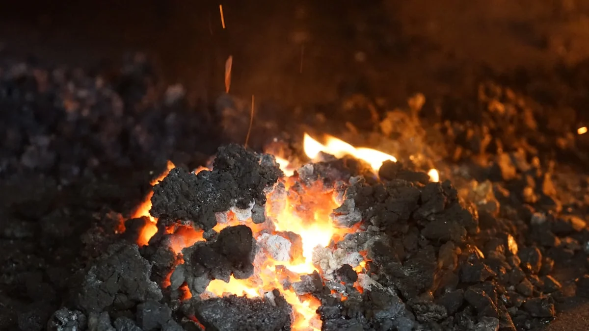 Glowing coals burn quietly in a dark hearth. — a The Obsidian Key guide to Protection Mistakes: Armor Paranoia and Private Wars.