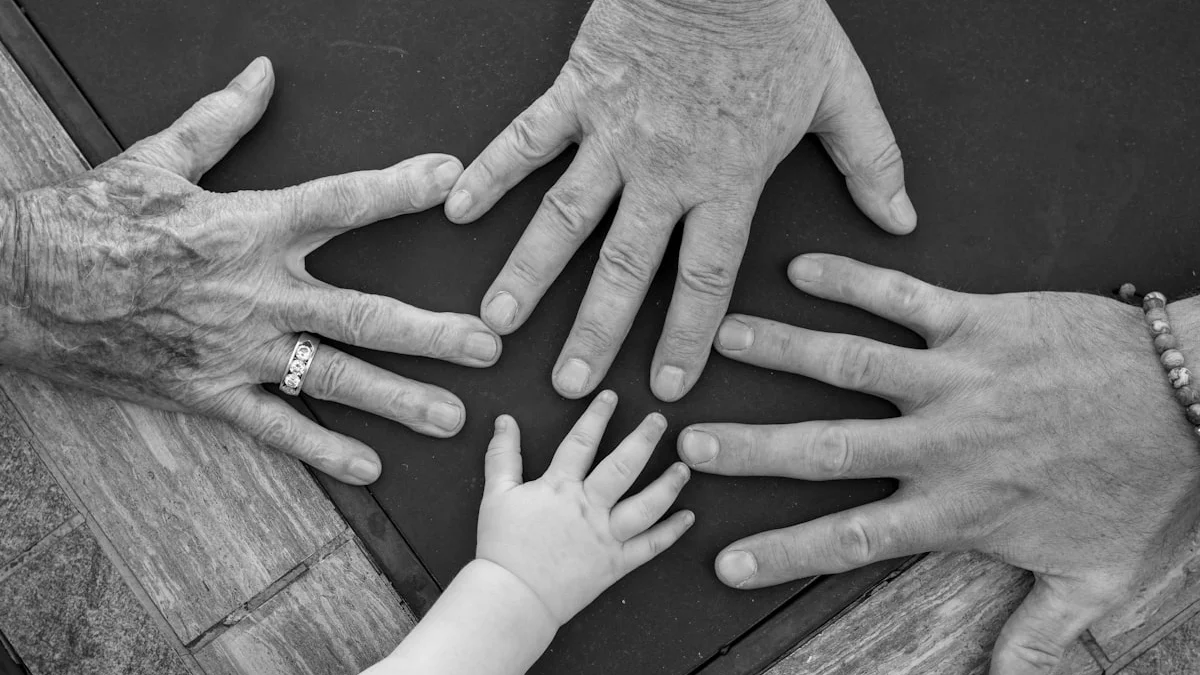Four hands of different ages reaching toward the center of a dark table in black and white. — a The Obsidian Key guide to Why You Deflect Compliments and Money.