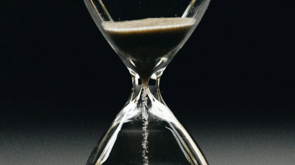 Sand falls through the glass bulbs of a wooden hourglass in warm side light. — a The Obsidian Key guide to Day 3, Day 7, Day 21: The Ritual Timeline of Signs.