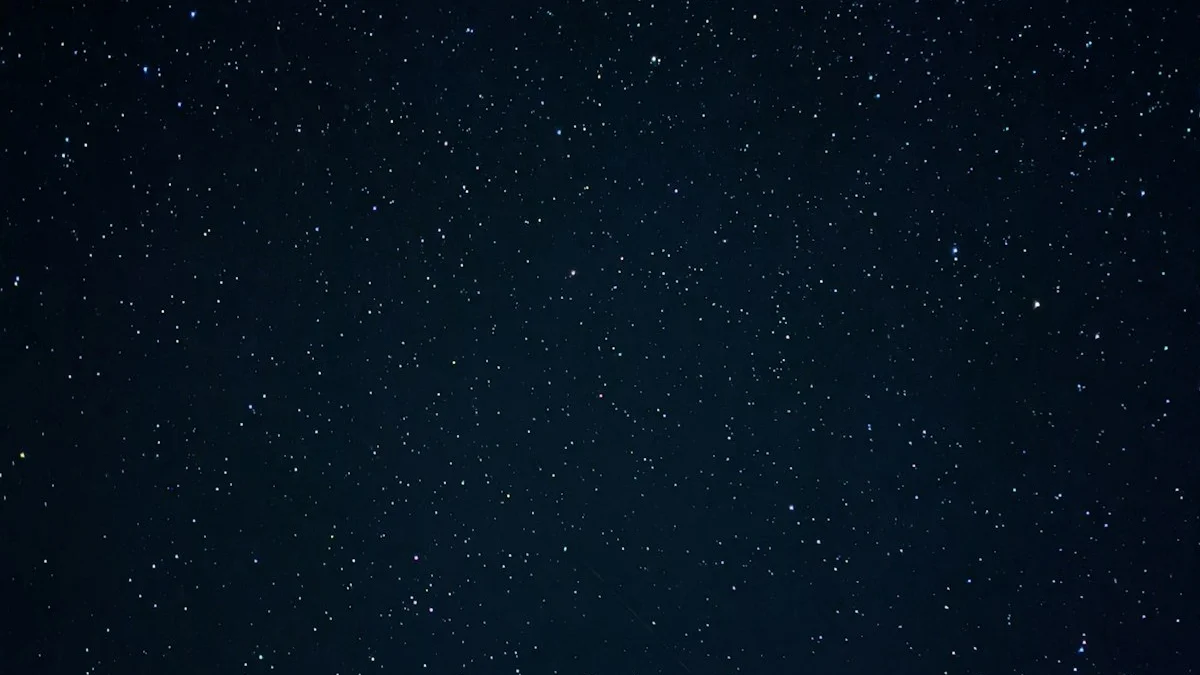 A field of faint stars scattered across a deep navy night sky. — a The Obsidian Key guide to Sleep and Manifestation: What the Night Does to the Signal.