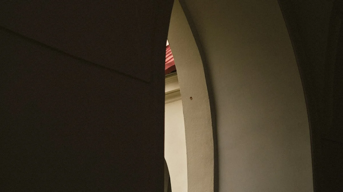 A dark stone archway opens onto a sunlit wall with a sliver of red roof beyond. — a The Obsidian Key guide to Start Tomorrow: Your First Morning in Four Steps.