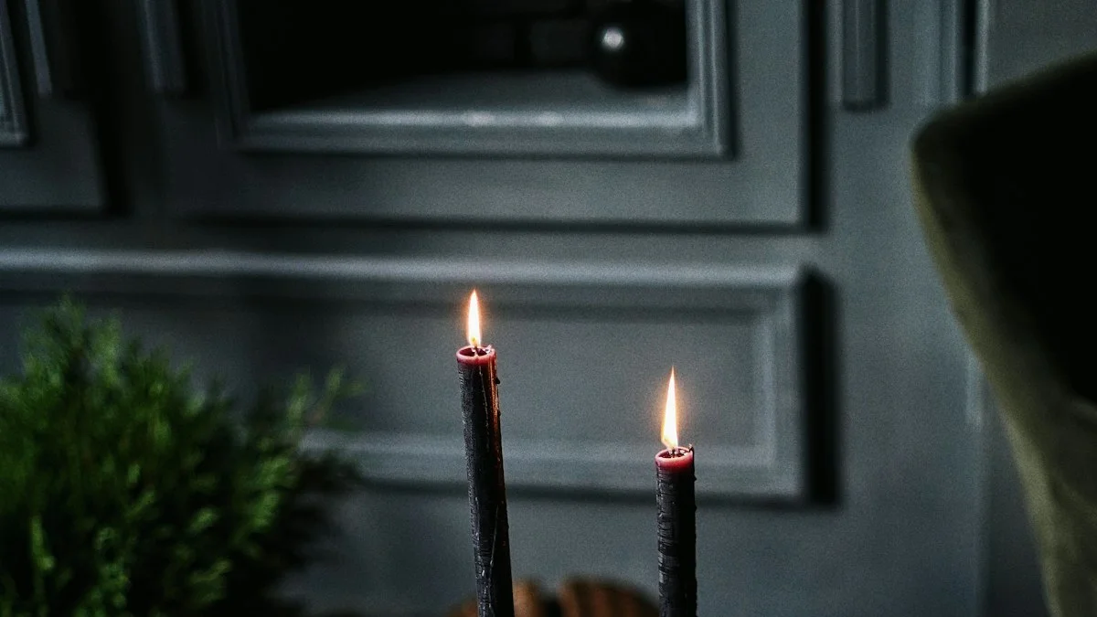 Two dark taper candles burn with small flames against a gray paneled wall. — a The Obsidian Key guide to The Evening Replay: Rewrite the Day Before Sleep.