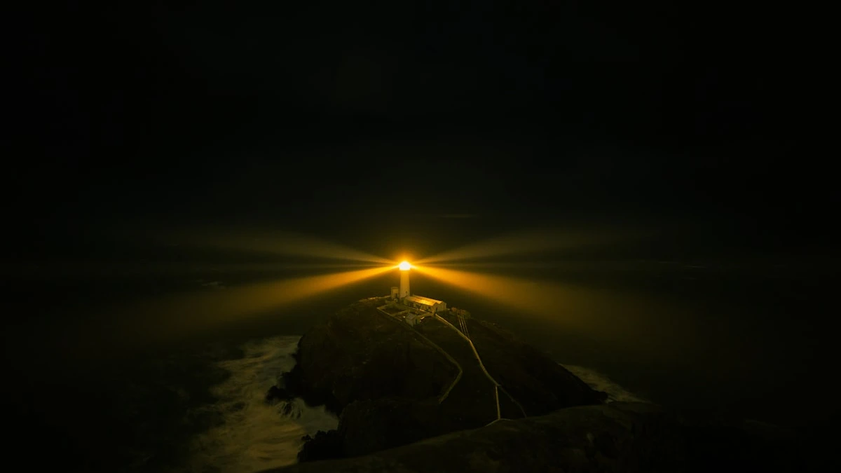 A lighthouse beam cuts through the darkness above a rocky island at night. — a The Obsidian Key guide to The Ninth Law: The Untouchable Flame.