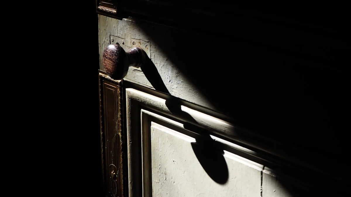 Sunlight throws the long shadow of a door handle across an old wooden door left closed. — a The Obsidian Key guide to The Probe: When Someone Tests Your Seal.