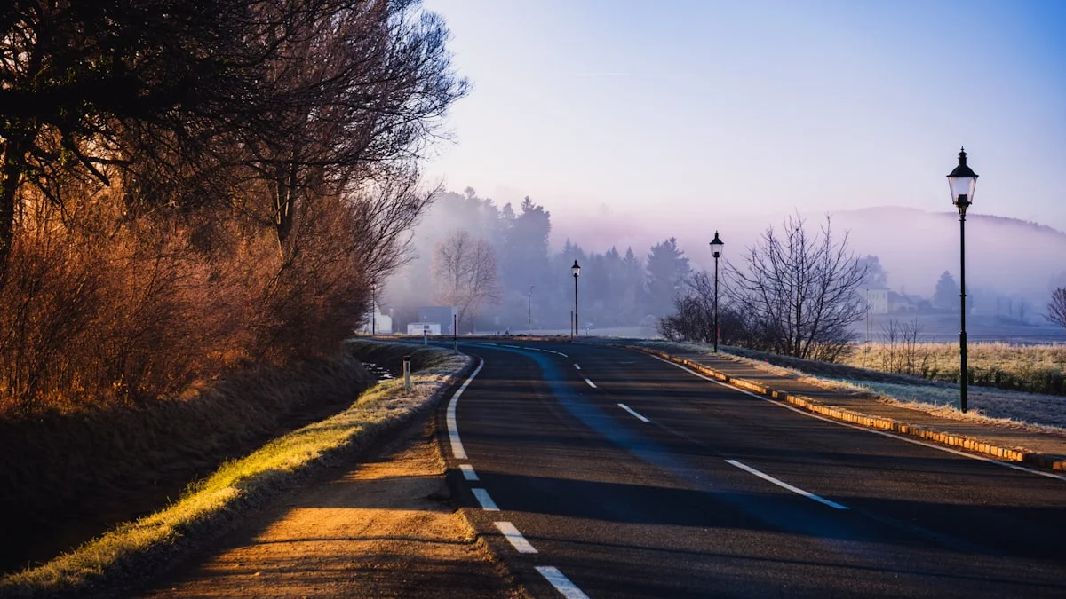 A country road curving through misty fields at sunrise. — a The Obsidian Key guide to The Split Moment: Where Timelines Fork.