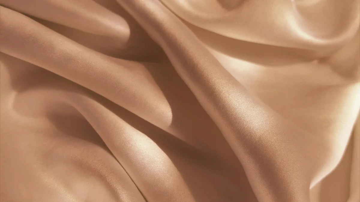 Heavy folds of pale silk fabric glowing with warm light. — a The Obsidian Key guide to The Veil: What It Means in The Obsidian Key.