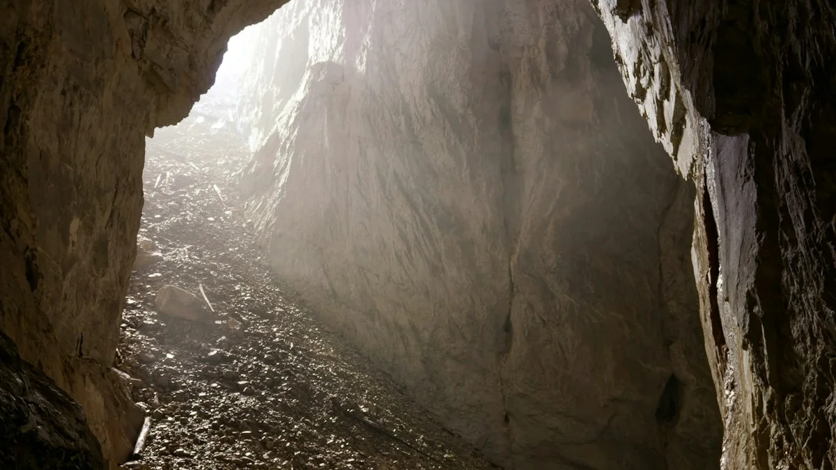 Bright daylight spills through the mouth of a dark cave onto wet stone. — a The Obsidian Key guide to Why Real Knowledge Keeps Leaking From Old Gates.
